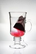 bag of fruit tea in a glass