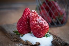 strawberries in sugar powder