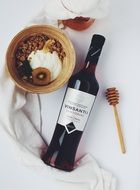 wine with honey and nuts on a white background