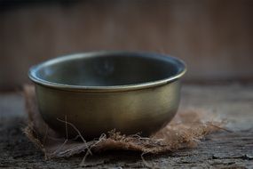 Brass bowl on the floor