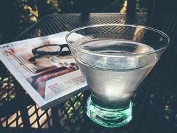 Martini as a cocktail on a table in the garden close-up