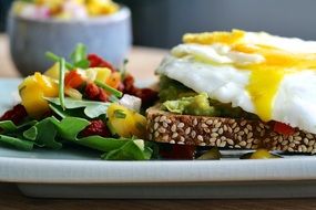 fried Eggs with bread breakfast meal closeup