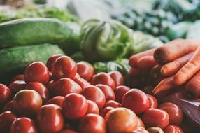 juicy tomatoes and carrots on the market