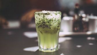 Green Drink with Ice in Glass