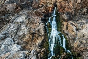 Beatiful waterfall from the rocks in the Gibraltar