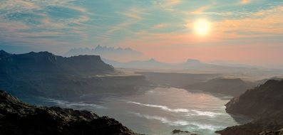 mountain range in the haze at sunset