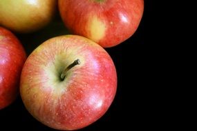 still life with apples on the black background