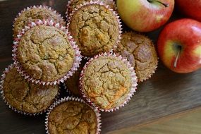 muffins lie next to apples