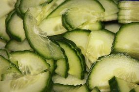 A lot of cut cucumber pieces