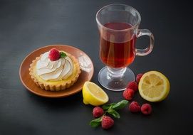 tea with cake decoration berries and lemon