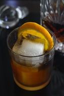 Drink with Ice and lemon in Glass