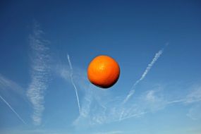 orange in the blue sky