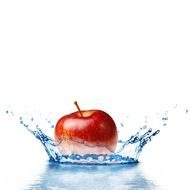 the picture shows an apple fall into the water