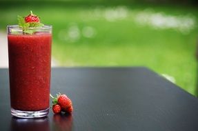 strawberry smoothie in a glass cup