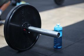dumbbell and bottle of water