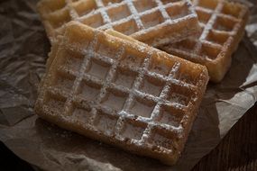 delicious waffles with powdered sugar