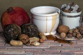 still life with various nuts and honey