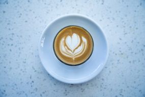 Heart form drawing on Cappuccino Coffee in Cup