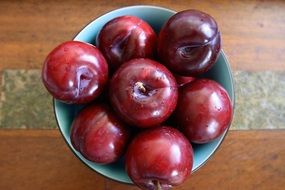 Fresh Plum Fruits in cup