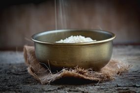 grains of rice in brass bowl