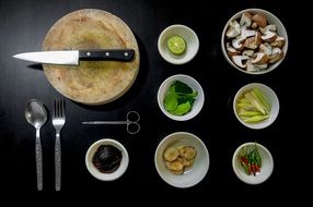 ingredients for the dish near the cutting board