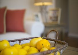 yellow ripe pears in a basket