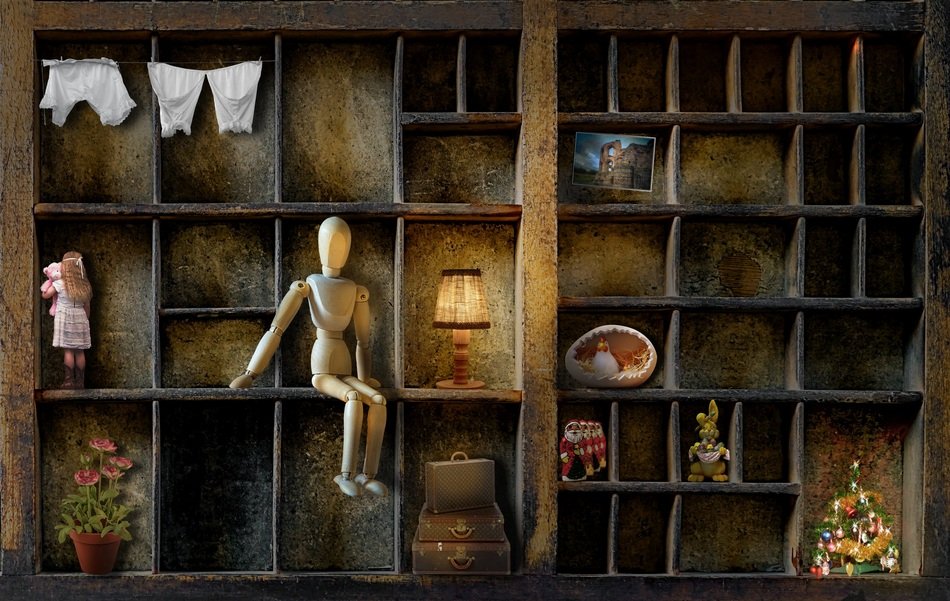 Wood doll on a drawer