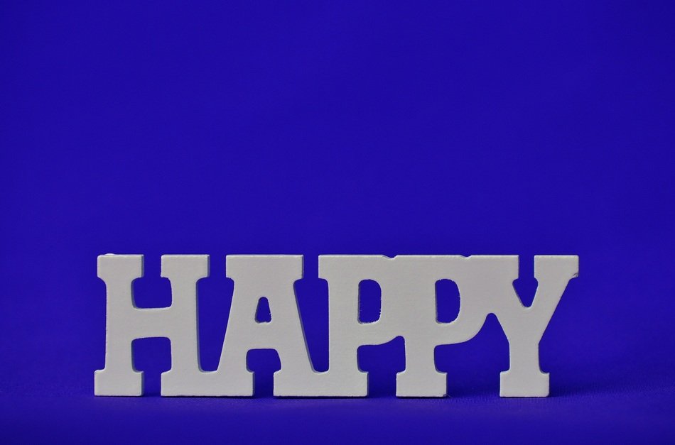 inscription Happy on the blue background