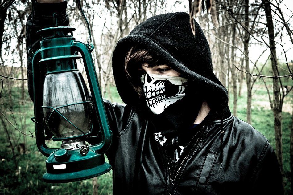 person in Skull mask with Lantern outdoor