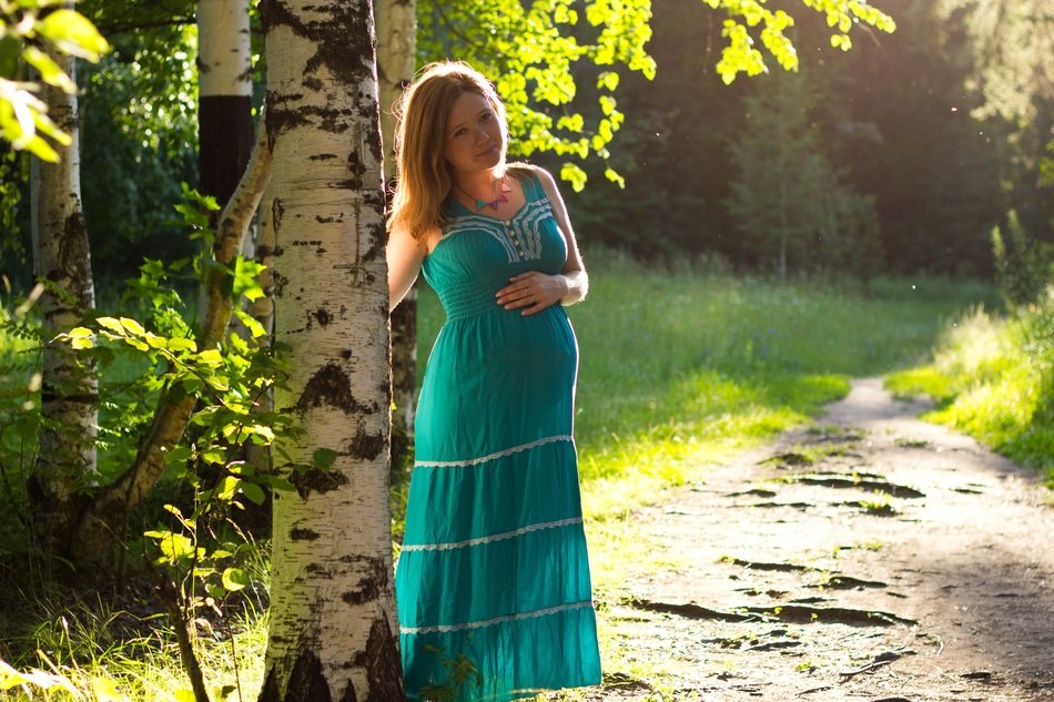 Pregnant girl in a forest