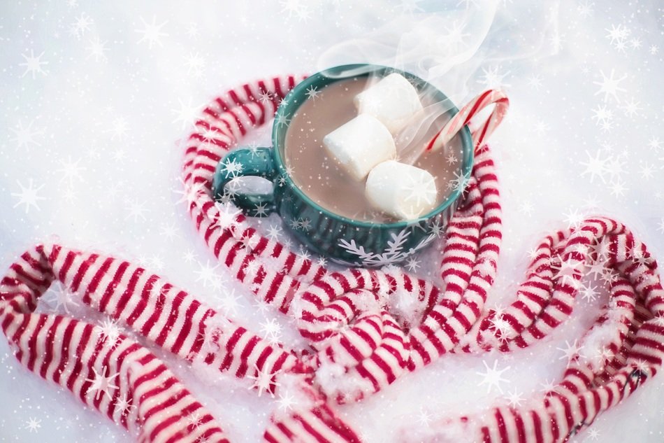 cup with a drink in the snow