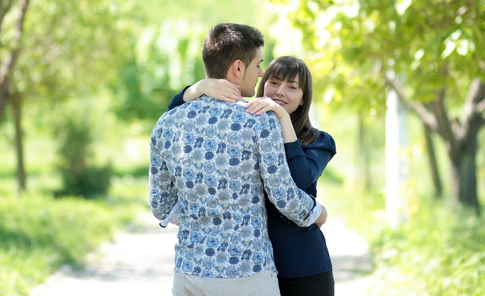 beautiful couple in love in the park on a sunny day