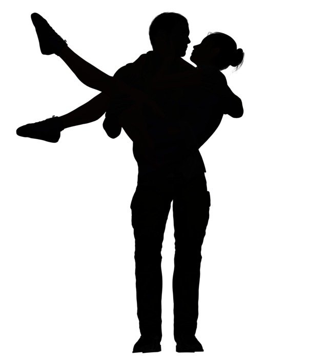 romantic silhouette of a woman in man's hands
