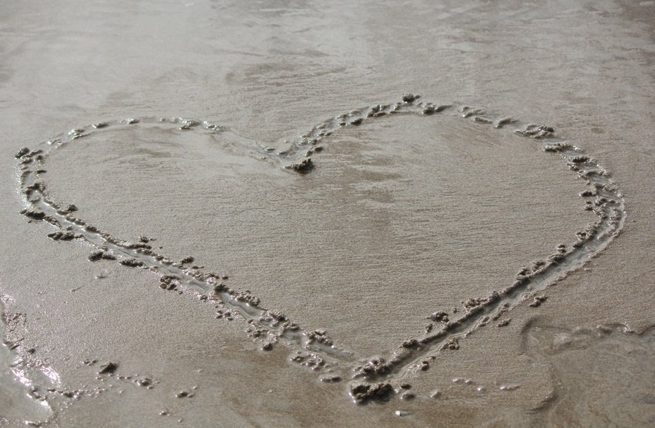 drawing hearts in the sand