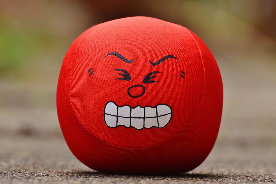 red ball with a fierce smile
