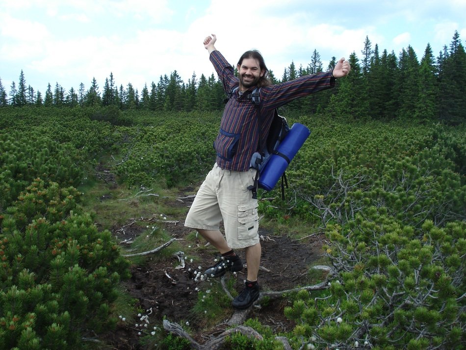 man with a backpack on the background of nature