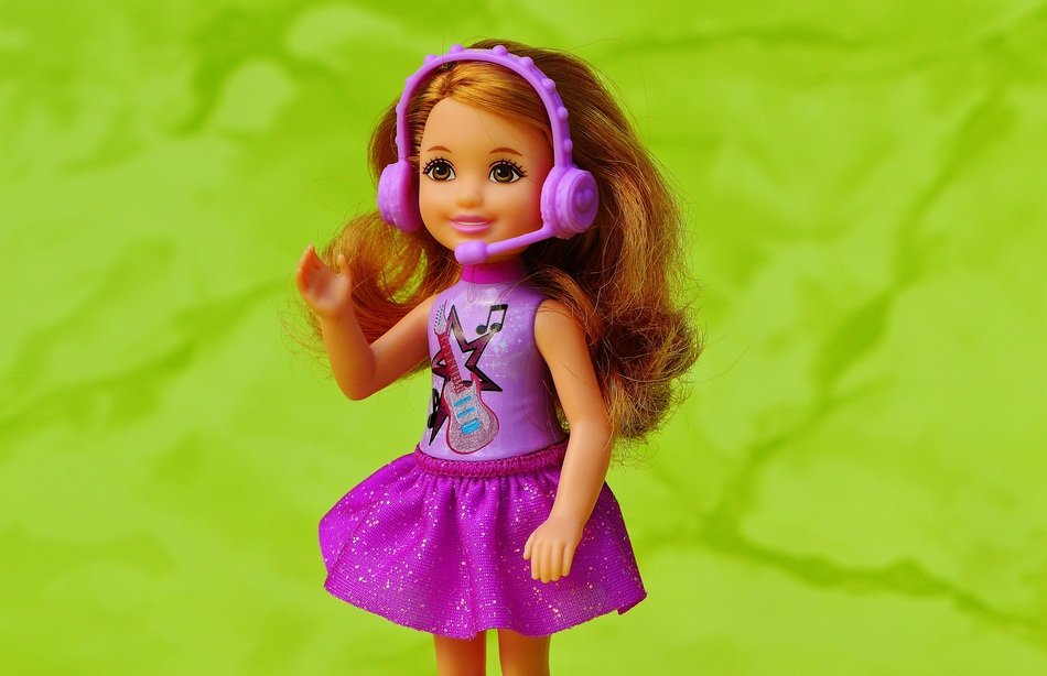 little doll with headphones with microphone