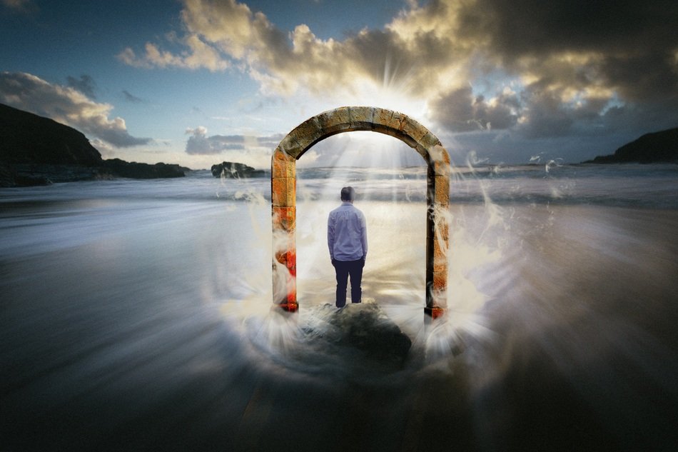 surreal image of a man under an arch in the ocean