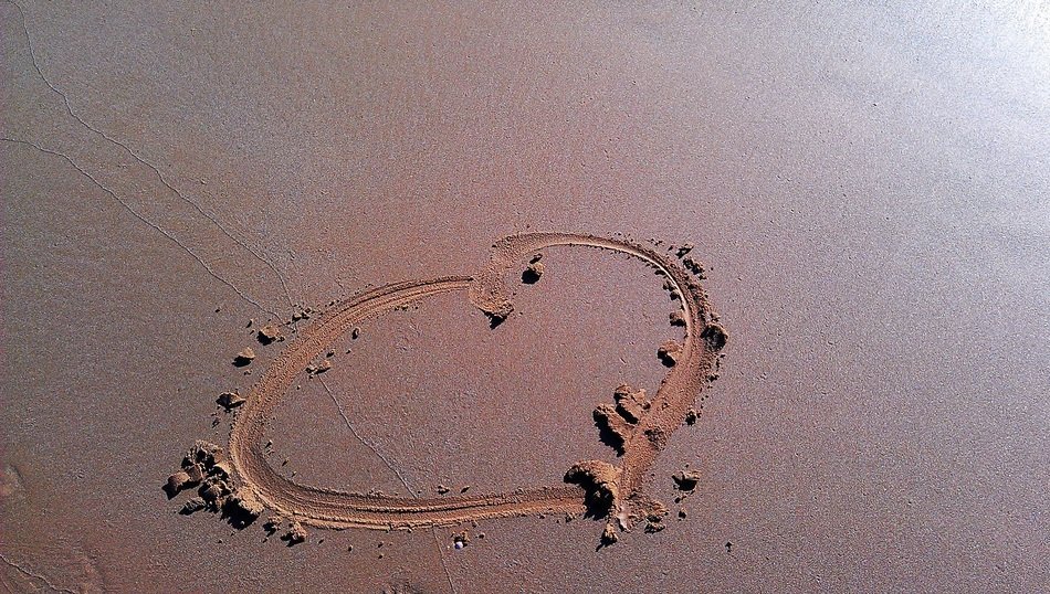 heart nerdvana on damp sand