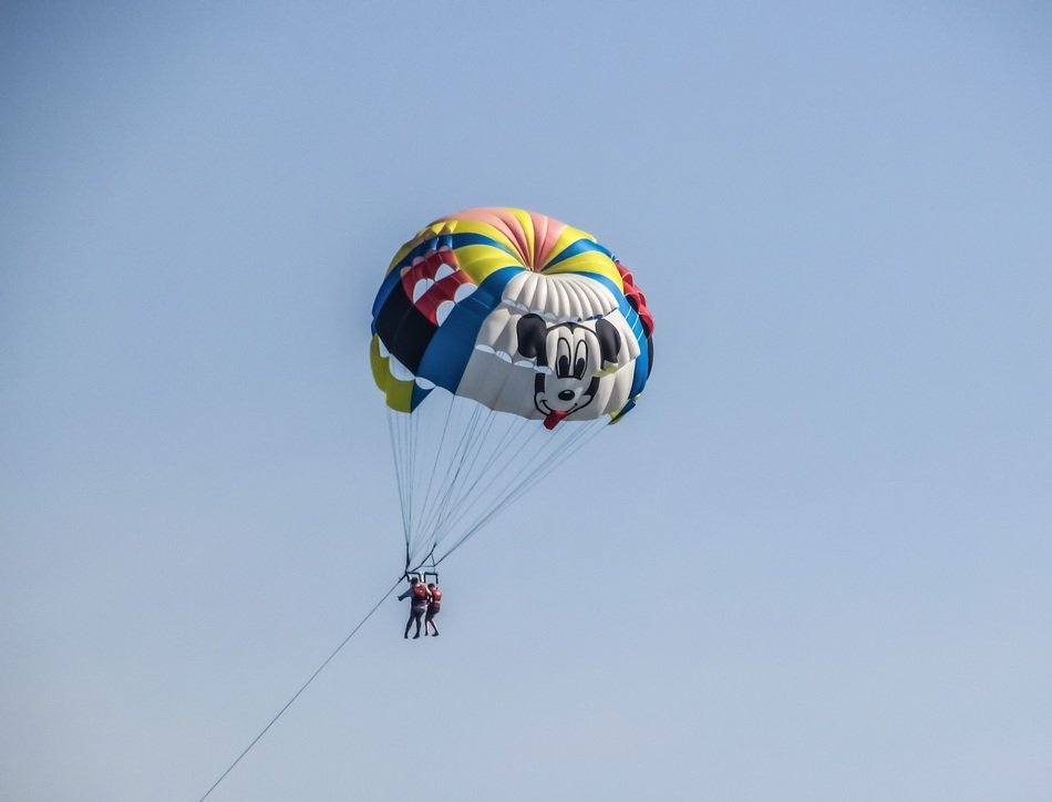 two peraons on Parachute at sky
