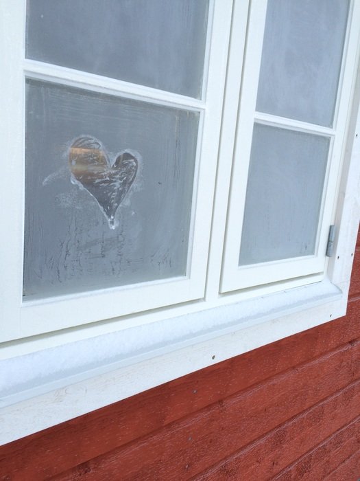 image of heart on frozen windows