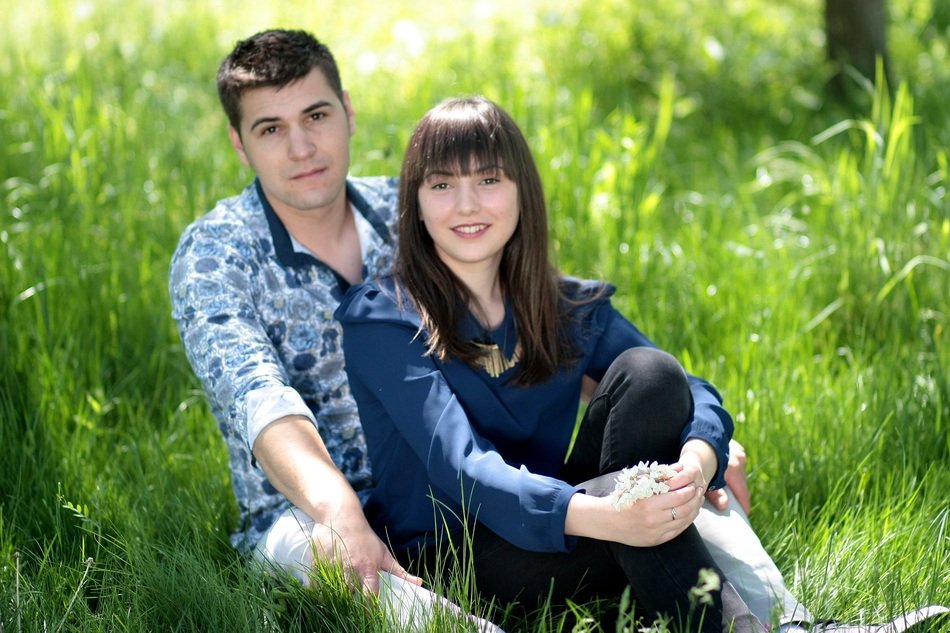 romantic pair posing in the park