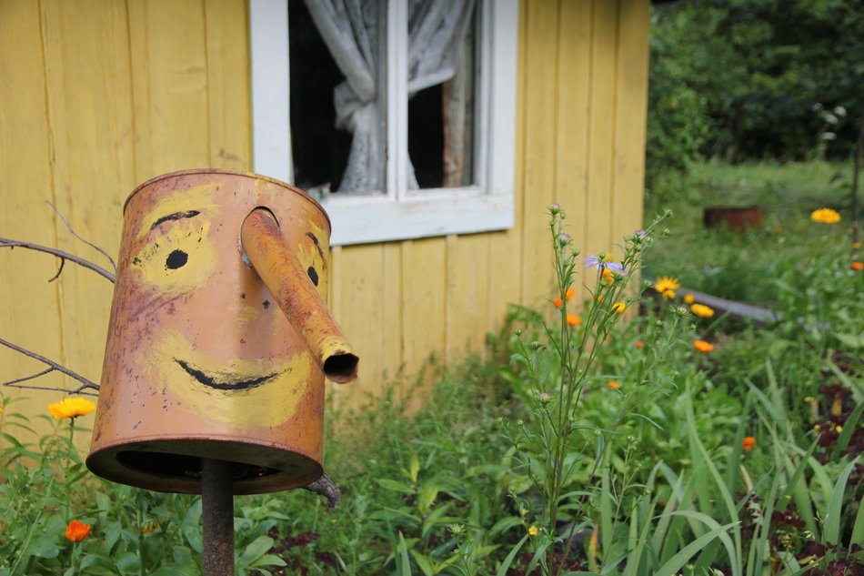watering can with a smile at the cottage