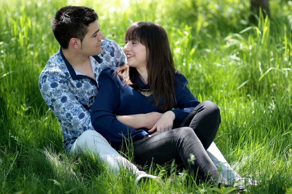 happy couple on the green grass