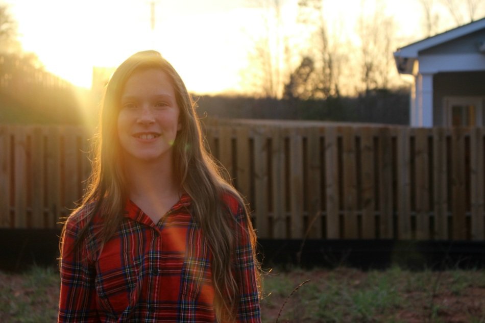girl smiling in the sunlight
