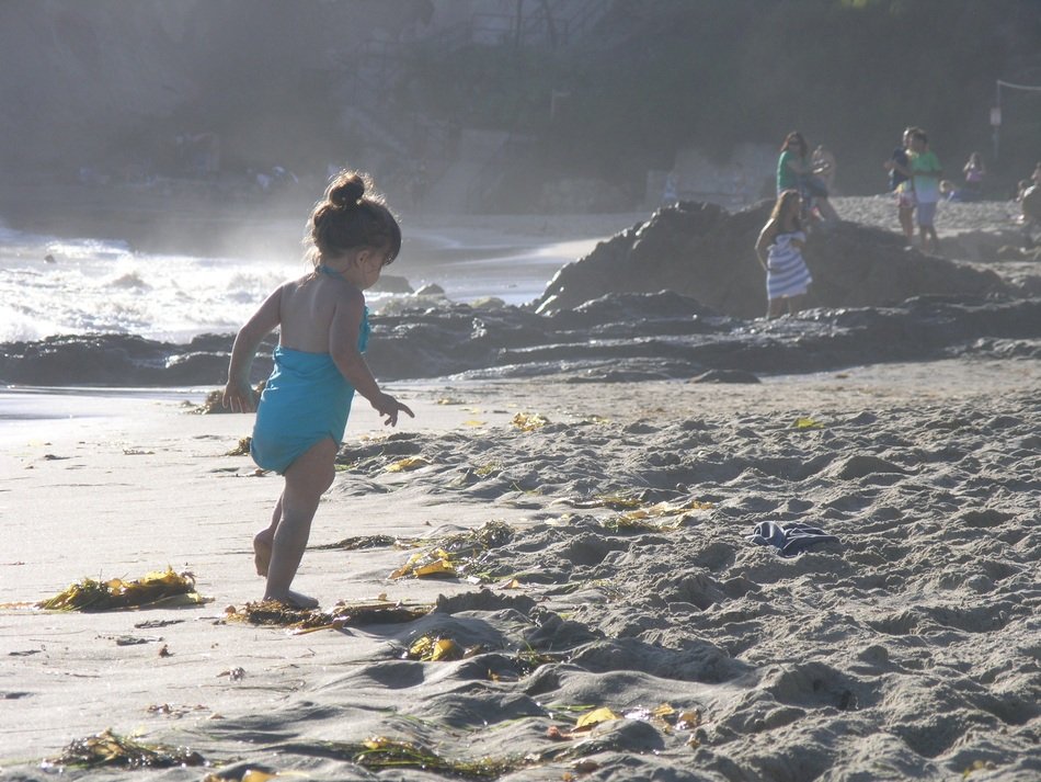 Baby on the beach near the ocean