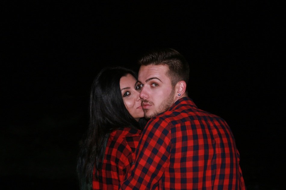 couple in love in black background