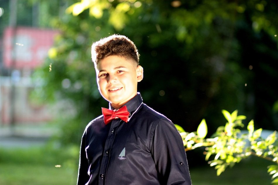 smiling boy in bow tie