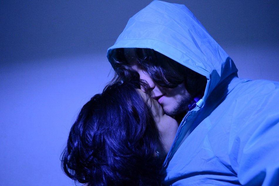 photo of a kissing couple in cold tones