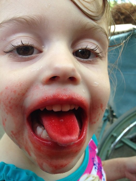 Girl with messy mouth close-up